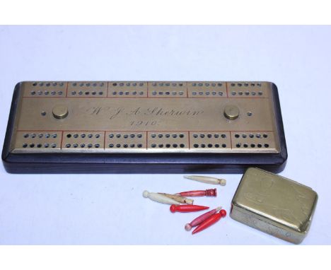 A antique brass cribbage board with brass box 