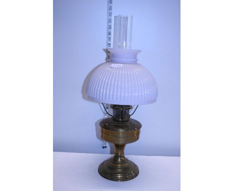 A antique brass oil lamp with opaque glass shade and chimney shipping unavailable 