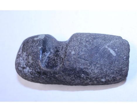 A stone axe head artifact (possibly North American) 