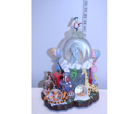 A Disney Store Dumbo theme mechanical musical snow globe 