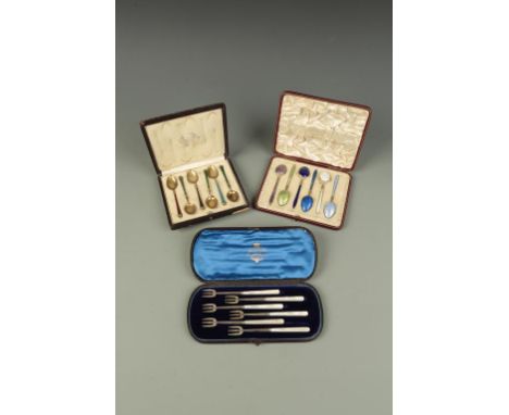 A CASED SET OF HORS D'OEUVRE FORKS with mother of pearl handles, Birmingham 1911, and two cased sets of Continental silver an