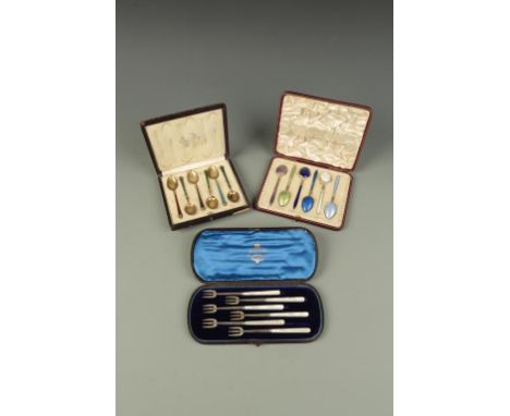 A CASED SET OF HORS D'OEUVRE FORKS with mother of pearl handles, Birmingham 1911, and two cased sets of Continental silver an