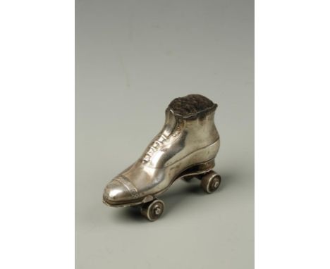 AN EDWARDIAN NOVELTY PIN CUSHION modelled in the form of a roller skate, engraved with a registration number, by Chrisford an