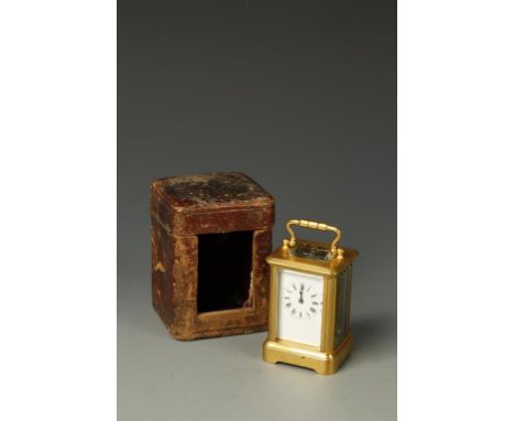RICHARD AND CO.: A FRENCH BRASS CASED MINIATURE CARRIAGE CLOCK, the white enamel dial with Roman numerals, the back plate sta