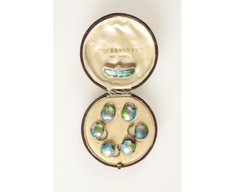 A SET OF SIX ENAMEL BUTTONS with silver loop backs, in a fitted "Queensway Art Enamel" presentation case, and a silver and en