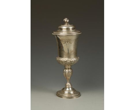 A CONTINENTAL CUP AND COVER of campana form, the domed pull-off cover with leaf bud finial, the body decorated with mythical 