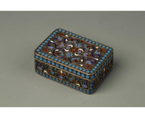 A RUSSIAN SILVER GILT AND ENAMEL SNUFF BOX of rectangular form, the body decorated in polychrome enamels, the interior stampe