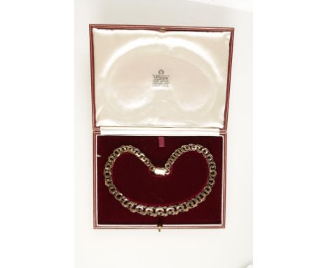 A 14CT YELLOW GOLD NECKLACE formed from graduating interlocking loop links, the concealed clasp hallmarked, with safety catch