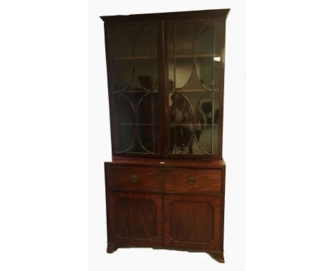 A MAHOGANY SECRETAIRE BOOKCASE, the upper section with twin glazed doors above a fitted secretaire drawer and twin cupboards 