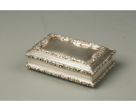 A VICTORIAN SNUFF BOX of rectangular form with raised foliate scroll borders, engine-turned cushion sides and base, with gilt