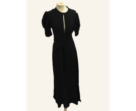 OSSIE CLARK FOR RADLEY: A BLACK EVENING DRESS, reminiscent of Ossie Clark's 'Come Fly with Me' design, full length in moss cr