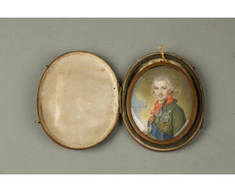 A PORTRAIT MINIATURE OF A GENTLEMAN WEARING A MILITARY UNIFORM, with blue sash and many awards, 2.75" x 2.25", in fitted case