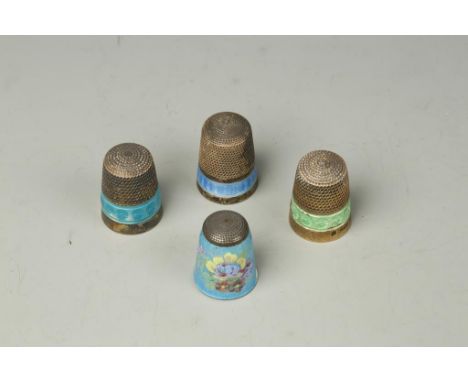 THREE SILVER THIMBLES, with bands of coloured enamel decoration and another similar thimble (4)