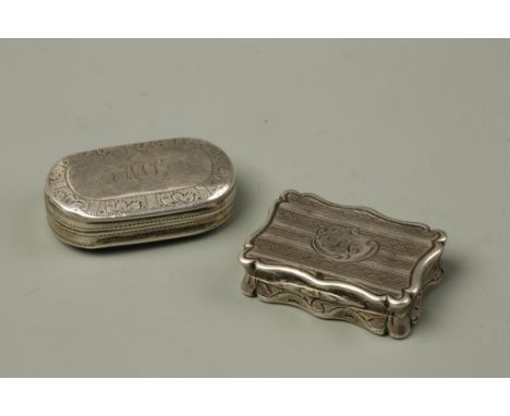 A VICTORIAN VINAIGRETTE of shaped rectangular form with engine-turned decoration, monogrammed, with foliate pierced grill, by