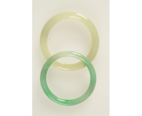 A JADEITE BANGLE and a jade bangle (2)