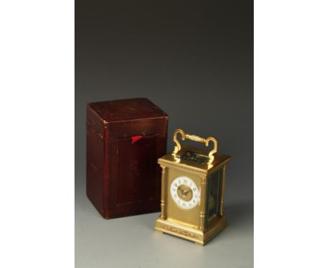 COUAILLET: A FRENCH BRASS CASED STRIKING CARRIAGE CLOCK, the cream chaptering with Arabic numerals, surrounded by a gilt bras