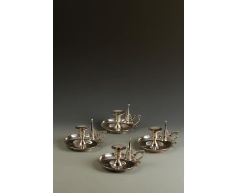 ROYAL INTEREST: A SET OF FOUR VICTORIAN CHAMBERSTICKS with pull-off conical snuffers, circular sconces, cylindrical stems and