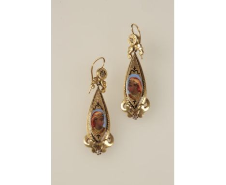 A PAIR OF ETRUSCAN STYLE DROP EARRINGS, each yellow gold oval panel depicting the portrait of an Egyptian lady, the scroll-wo