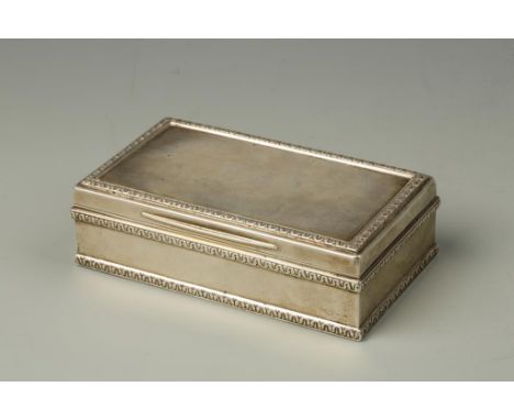 A TABLE SNUFF BOX of rectangular form with raised wriggle-work borders and gilt interior, possibly by Charles Dumenil, London