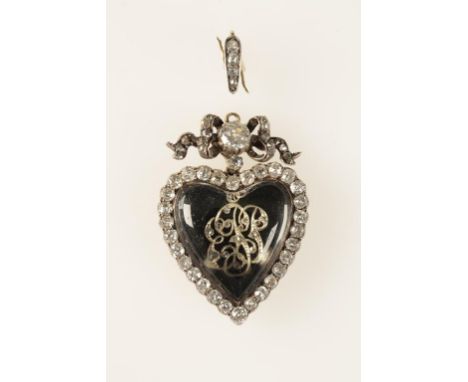 A VICTORIAN HEART SHAPED ROCK CRYSTAL AND DIAMOND LOCKET PENDANT, the rock crystal heart enclosing rose-cut diamond encrusted