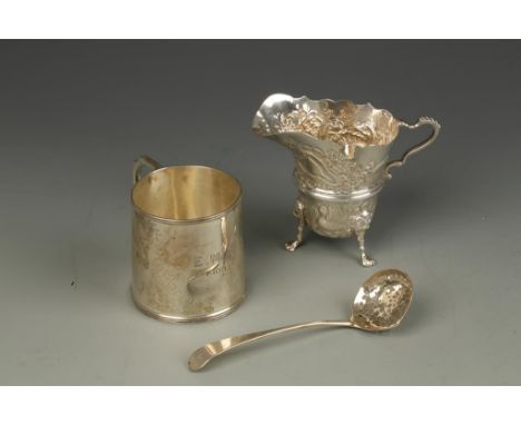 A CREAM JUG decorated in the Irish taste with animals and sea creatures, Birmingham 1969, a mug and a small sifter ladle, (c.