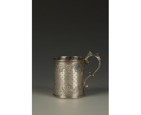 A VICTORIAN CHRISTENING MUG of circular form, with a beaded scroll handle, the body with engine-turned decoration, monogramme