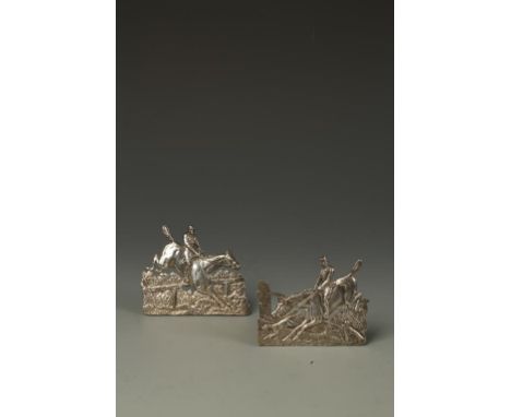 HUNTING INTEREST: A PAIR OF VICTORIAN MENU CARD HOLDERS modelled in the form of huntsmen jumping fences, by Samuel Jacob, Lon