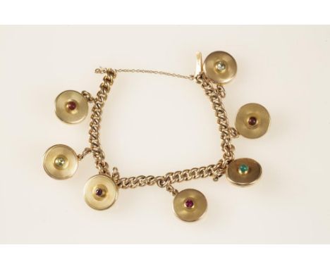 A 15CT YELLOW GOLD CURB LINK BRACELET, suspending seven circular engine turned lockets, each with various hard stone and prec