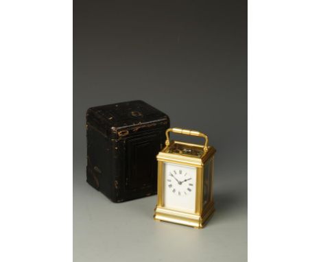 DROCOURT: A FRENCH BRASS GORGE CASED REPEATING CARRIAGE CLOCK, the white enameled dial with Roman numerals, the back plate wi