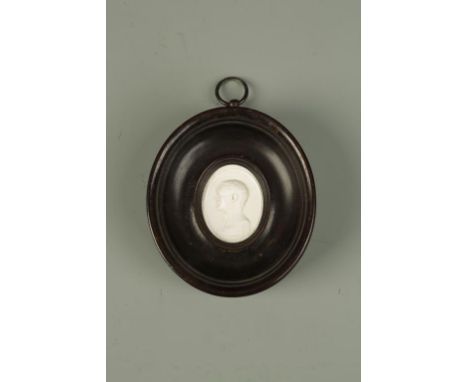 A CARVED CAMEO: a profile portrait, possibly Nathaniel Marchant, in turned frame