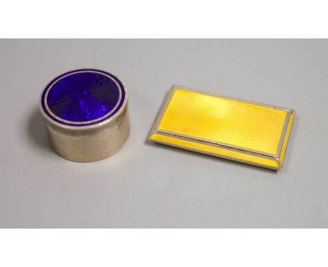   A 1920's silver and yellow guilloche enamel cigarette case, 81mm and a white metal and blue enamel pill box,gross 162 grams