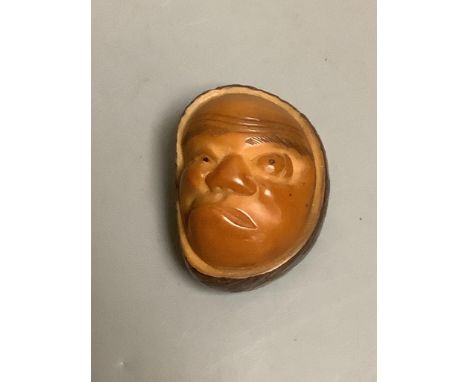   A Japanese carved nut mask netsuke
