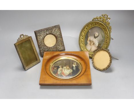   A Victorian framed miniature (snuff box lid) of children in a nursery, another miniature and three small frames, largest 10
