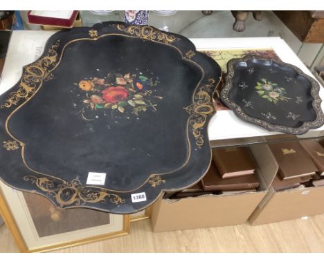   A Victorian papier mache shaped tray with painted floral panel with mother of pearl and a smaller similar tray, largest 78 