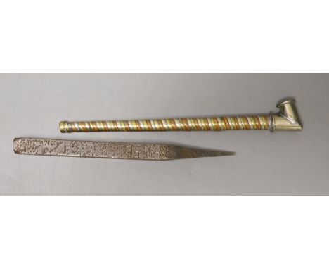   An Islamic architectural nail (driven into the rafters of house during its initial blessing) and a white metal tobacco pipe