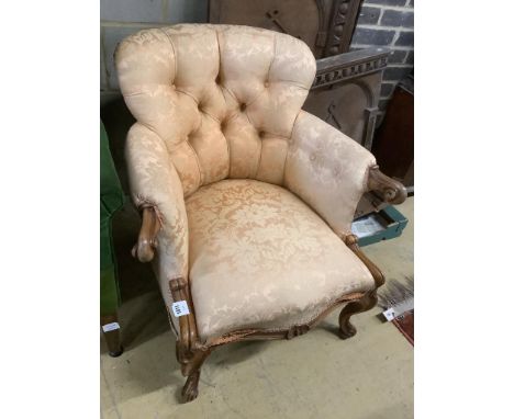   A Victorian walnut button back armchair, width 77cm