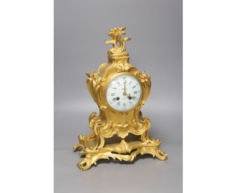   A late 19th-century French rococo revival gilt mantel clock, 40cm high