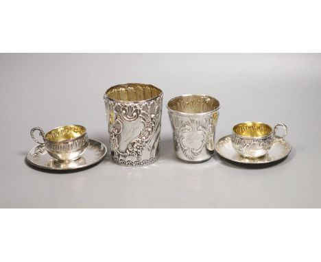   A pair of French white metal cups and saucers and two similar tumblers,8oz.