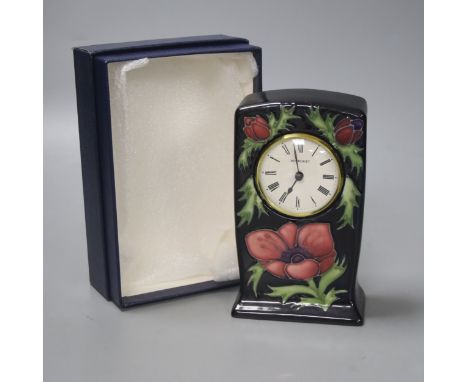  A Moorcroft pottery Anemone pattern quartz clock, height 15.5cm