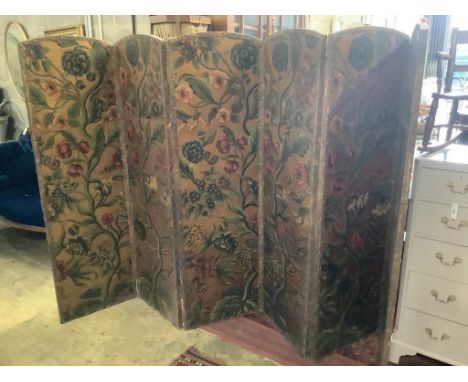   A Spanish leather folding six panel draught screen, with embossed floral printed card panels, height 168cm