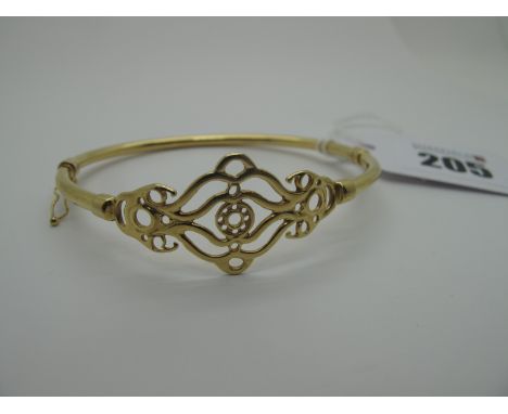 A Modern Hinged Bangle, of openwork design to the front (sprung hinge) (5grams). 
