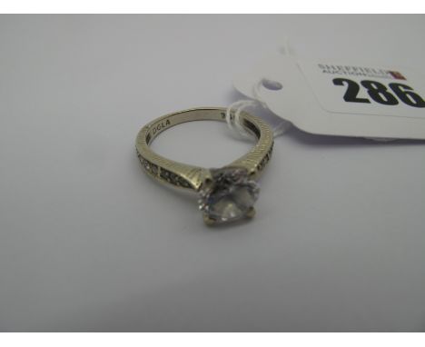 A Modern Single Stone Dress Ring, stamped "14k" (finger size O) (2.9grams). 