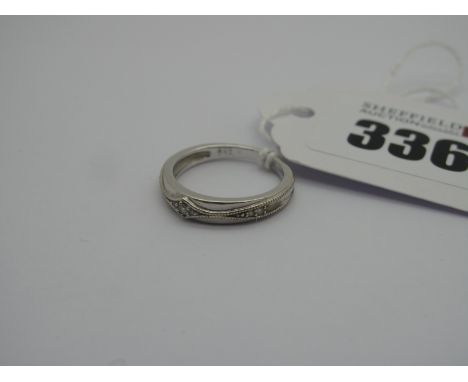 An 18ct White Gold Diamond Set Band Ring, stamped "18K" "0.05" (finger size K) (2.5grams). 