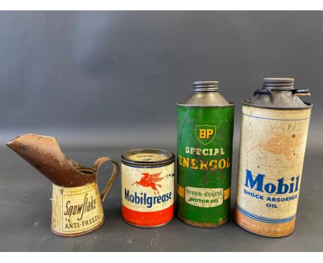 A Mobil Shock Absorber Oil quart can on bulkhead bracket, a BP Energol quart can, a Mobilgrease tin and a Snowflake Anti-Free