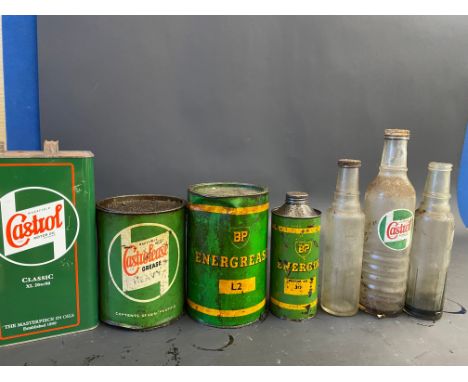 A Wakefield Castrol 7lb grease tin, a second for BP, a BP Energol quart cylindrical can and three oil bottles etc.