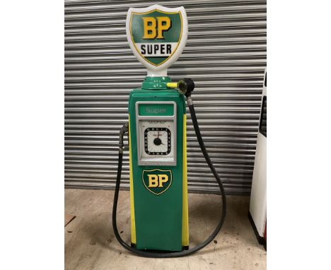 An Avery Hardoll 101 electric petrol pump, restored in BP livery, with a reproduction BP glass petrol pump globe.