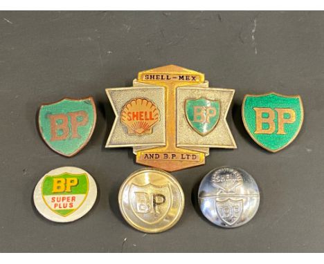 A Shell-Mex &amp; BP Ltd cap badge, two BP enamelled lapel badges, a BP Super Plus badge and two BP buttons.