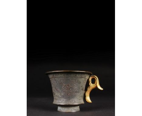 Tang dynasty (618 – 907 AD) This cup is cast and hammered silver with a chaste and ring-punched decoration. There is a gilt h