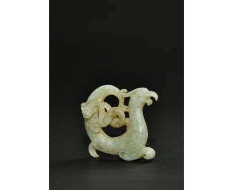 This is a jade phoenix and dragon carving representing symbols of yang and yin. The iconography suggests the power of the fem