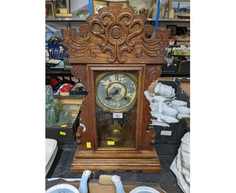 An Eight day striking wooden mantle clock  